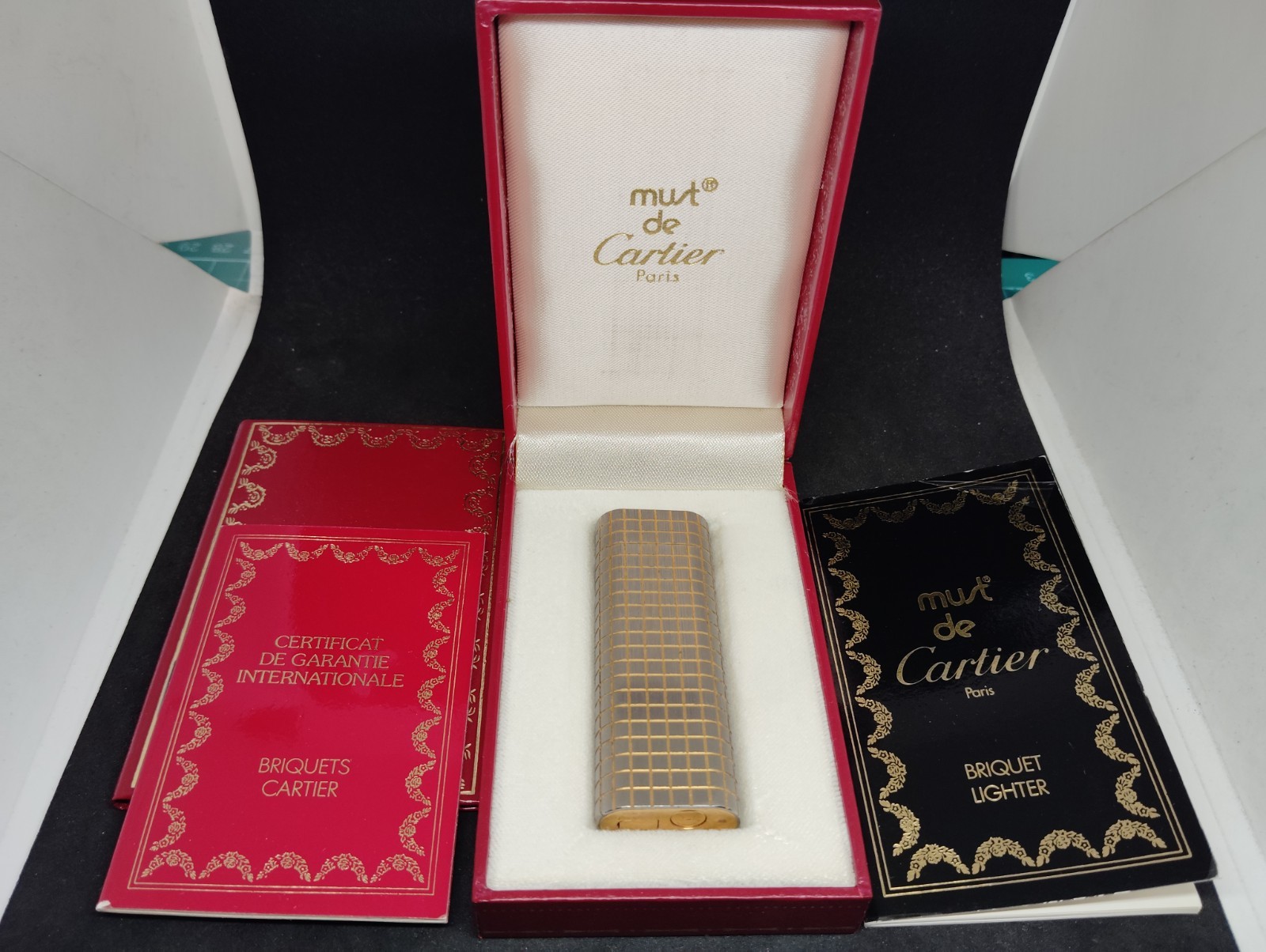 Vintage Cartier gas lighter silver and gold lines oval with box.